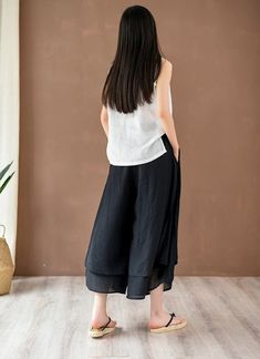 Feel at ease while wearing these Elegant Flowy 3/4 Length Palazzo Pants. This casual piece is a soft and comfortable fit you can enjoy daily. Simply slip on the elastic waist of these pants for a day full of relaxation and style. Pair with your favorite cami and sandals and you'll be ready for a day of fun! Specifications Length: 3/4 Closure: Elastic Waist Fit: Loose Fit Material: Polyester, Rayon Pattern: Solid Features: Pockets Effortless Black Bottoms For Spring, Casual Relaxed Fit Cropped Culottes, Versatile Ankle-length Relaxed Fit Culottes, Relaxed Fit Ankle-length Culottes, Casual Relaxed Fit Ankle-length Culottes, Casual Relaxed Fit Culottes, Black Cropped Wide Leg Summer Pants, Black Cropped Wide Leg Pants For Summer, Spring Casual Capri-length Harem Pants