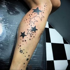 a woman's arm with stars on it