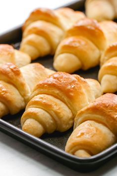 freshly baked croissants on a baking tray ready to be eaten for lunch