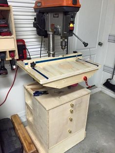 a workbench in a garage with tools on it and an electric driller