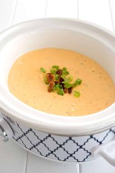 a white bowl filled with soup on top of a table