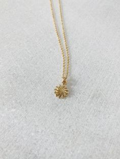 "This solid 14k gold charm is stunning and has a great detail. The slightly curved sun beams and its dome shape add dimension. The pendant measures approximately 8 mm. Now available with the 16 or 18\" dainty solid 14k gold chain. The sun will be suspended on 4 mm open bail (see 1st photo) If you only purchasing the charm, select bail size: 4 mm 14k open jump ring bail and can accommodate chains up to 1.6 mm. 6 mm 14k closed bail that can suit thicker necklaces. Hallmarked 14K 14k sand dollar ch 14k Yellow Gold Sun Design Jewelry, 14k Yellow Gold Jewelry With Sun Design, 14k Gold Sun Design Jewelry Gift, Yellow Gold Sun Design Jewelry Gift, Yellow Gold Sun Design Jewelry As Gift, Silversmithing Jewelry, Thick Necklace, Sand Dollar Pendant, Solid Gold Charms