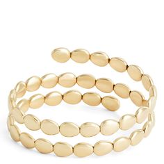 Our Toscano Collection celebrates gold’s lasting impact on style and creativity. We work with Italian artisans to bring you unique pieces that are as versatile as they are beautiful. This wrap bracelet is made with 14k yellow gold formed into beautiful beads that wrap around the wrist for an intriguing stacked look. Every piece from the collection pays tribute to generations of Italian gold jewelry making tradition combined with contemporary styling. Elegant Gold Bead Bangle Bracelets, Modern 14k Gold Oyster Bracelet, Elegant Gold Beaded Bangle Bracelet, Elegant 14k Gold Cuff Bracelet With Oyster Design, Elegant 14k Gold Cuff Bracelet With Oyster Detail, Elegant 14k Gold Bracelet With Gold Beads, Stackable Gold Plated Bracelets Fine Jewelry, Stackable Gold Plated Bracelets In Fine Jewelry Style, Flexible Yellow Gold Bracelets Fine Jewelry