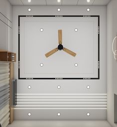 a room that has a ceiling fan in the middle of it and some lights hanging from the ceiling