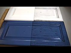 blue and white cabinet doors are stacked on top of each other in order to be painted