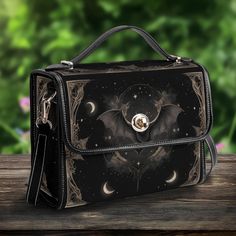 Gothic Bat Vegan Leather Satchel - Elegant Crossbody Handbag with Celestial Elements Design Perfect Gift for Women and Girls Experience sophistication and functionality with this New Version PU Leather Satchel Bag. Crafted from high-quality PU leather, it boasts an adjustable shoulder strap for cross-body or shoulder carrying, along with convenient top handles for hand-carrying. Perfect for everyday use, work, travel, or casual outings, this satchel bag effortlessly combines style with practical Celestial Elements, Elements Design, Turtle Love, Leather Satchel Bag, Leather Satchel, Gift For Women, Satchel Bags, Gifts For Girls, Cross Body Handbags