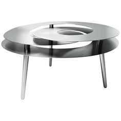 two metal tables sitting on top of each other