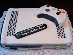 a birthday cake with a controller on it for someone's 30th birthday or other special occasion