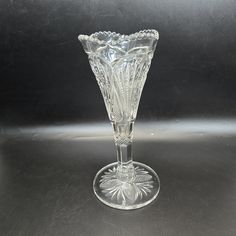 a clear glass vase sitting on top of a table