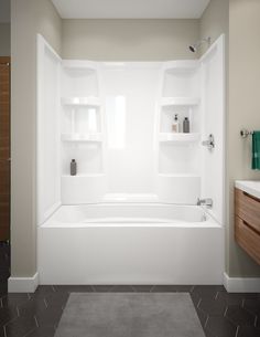 a white bath tub sitting inside of a bathroom