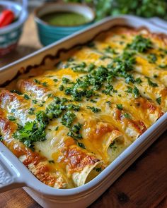 a casserole dish with cheese and herbs