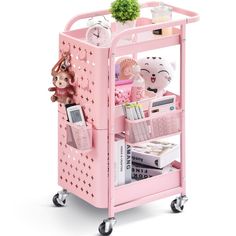 a pink toy cart with various items on it and a stuffed animal in the back