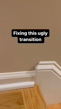 the corner of a room with a sign saying fixing this ugly transition