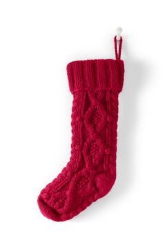 a red knitted stocking hanging on a wall