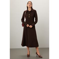 Black crepe (94% polyester, 6% elastane). A-line. Long sleeves. Collar. Front button closure. 49.2" from shoulder to hemline. Imported. Classic Shirt Dress, Favorite Boots, Rent The Runway, Closet Designs, Shirtdress, Gold Buttons, Tory Burch, A Line, Shirt Dress