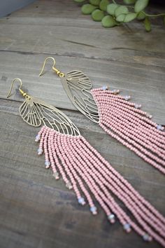 These gorgeous pink terracotta beaded earrings are made with high quality Japanese, Czech glass seed beads, gold crystal beads, hypoallergenic nickel free gold color butterflies and gold tone ear wire hooks. Other finishes are also available.  6 3/4" inches in length from ear hook to last bead 1  " wide *All orders are shipped within 3-7 business days (after the order has been placed) by first class mail with a tracking information. If you need sooner please let me know. All custom orders will b Pink Beaded Earrings, Gold Butterfly Earrings, Pink Terracotta, Terracotta Pink, Butterfly Earrings Gold, Beaded Fringe Earrings, Earrings Butterfly, Bead Sewing, Pink Beaded