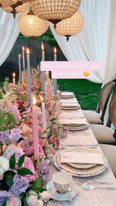 a long table with flowers and candles on it is set up for a formal dinner