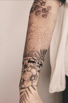 a person with a flower tattoo on their arm