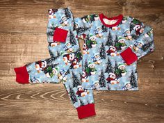 Christmas Penguins pajamas are here!  These pajama sets have Christmas and winter themed penguins scattered throughout. The fabric is soft, stretchy and oh so cozy. The fabric is slightly thicker/heavier in weight. They trimmed in a red fabric.  This also would be great for matching sibling sets!  💜Please check out all my other mama made outfits here: Mamapakscloset.etsy.com 💜Also visit my Facebook page at mamapakscloset. Stay up to date on new Fabrics, preorder fabrics, new patterns and possi Made Outfits, Penguin Pajamas, Christmas Penguins, Christmas And Winter, Holiday Pajamas, Winter Themed, Christmas Penguin, Clothing Sets, Pajama Sets