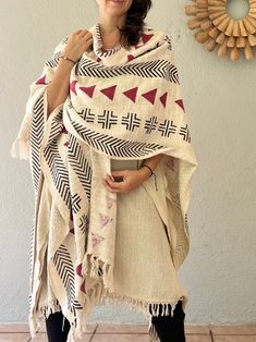 Gorgeous handwoven poncho with a black print. It is handmade from a 100% handwoven hand-block printed cotton. Planet-loving piece! This beautiful textured poncho has a nice and soft touch. Black and white hand-block print resembles the tribal print of the African mud cloth.  The fabric was hand printed by the local artisans near Jaipur, Rajasthan in India using the hand-carved wooden blocks.  It is amazing to see how the centuries-old traditions of Africa and India are being expressed in the contemporary prints. It truly is the beauty that is timeless.  This poncho is a beautiful statement piece. It's great for the facilitators of intentional gatherings, wanderers, nomads and free spirits. It works perfect as a cover up, a throw or a large scarf. It is warm and soft and will be a great add Cotton Shawl Poncho, Handwoven Poncho, Red Woods, Contemporary Prints, Cotton Shawl, African Mud Cloth, Small Boutique, Large Scarf, White Hand