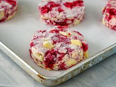 raspberry and almond cookies on a baking sheet