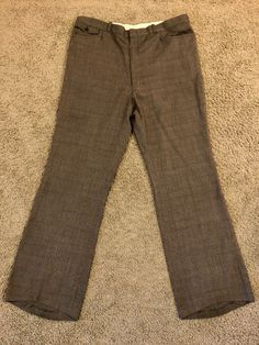 "Vintage Men's 80's Brown, Plaid, Straight Leg, Pants (W40) 1097 These Men's Pants come in a brown polyester/viscose blend and has a plaid print in blue and orange with a zipper fly, five pockets, and straight leg fit with a pressed seam. The pants are heavy weight and do not stretch and are not lined. 65% Polyester 35% Viscose *These pants are in like new condition. *If shipped within the US, they will go Priority Mail for a quick delivery! Size: (W40 x L32) Waist: 40\" Hips: 44\" Inseam: 33\" Mens 80s, Brown Plaid, Vintage Men, Mens Pants, Like New, Straight Leg, Zipper, Plaid, Pants