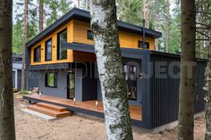 a small house in the woods surrounded by trees