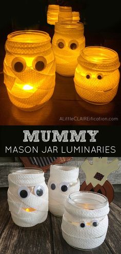 some mason jar luminaries with eyes on them