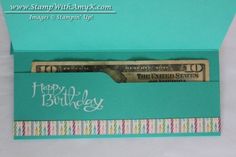 a birthday card in a box that has money inside and writing happy birthday on it