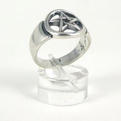 The Pentagram star symbolizes protection, life and health. Sterling Silver. Band width 12 mm at widest point. Comes with meaning card and gift box. There are many Pentagram rings on the market, but few compare to the quality and weight of this Jane Iris Design. Spiritual Star-shaped Ring As A Gift, Happy Solstice, The Pentagram, With Meaning, Star Ring, Ring Fit, Gothic Jewelry, Silver Band, Rings Statement