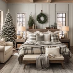 a bedroom decorated for christmas with plaid bedding, pillows and wreaths on the wall