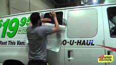 a man is painting the side of a van