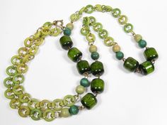 "Vintage 1970s Dark & Lime Green Wood Bead & Gold Tone Necklace 30\" Open Circles Beautiful dark green and lime green open circle wood beads, half cylinder beads, linked with gold tone loops. Spring ring clasp Measures 30\" Circa: 1970s Very good condition. Please see photos. Thank you!" Retro Green Beaded Necklace For Gift, Vintage Green Wooden Beads, Green Vintage Jewelry With Wooden Beads, Handmade Retro Green Beaded Necklace, Vintage Green Beaded Chain Jewelry, Vintage Green Jewelry With Beaded Chain, Retro Green Beaded Necklaces, Vintage Green Necklace With Wooden Beads, Vintage Green Necklace With Beaded Chain