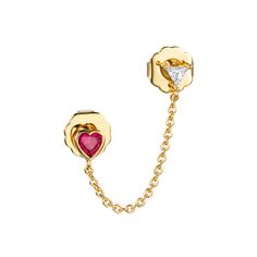 a pair of gold chain earrings with red heart and white diamond in the center, set on