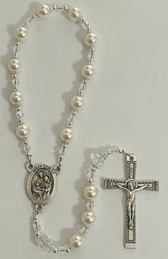 Single Decade Rosary done with a combination of white pearl beads, with clear crystal and silver metal accents. A lovely handheld option for a Baptism, First Communion, or Confirmation. A wonderful tool for prayer or have it blessed to hang in your vehicle. Silver Beaded Rosary For First Communion, Silver Pearl Rosary For First Communion, Elegant Silver Rosary For First Communion, White Pearl Rosary For Baptism, Silver Pearl Rosary With 8mm Beads, Adjustable Silver Pearl Rosary, Wedding Silver Pearl Rosary, Silver Rosary For Baptism, Silver Baptism Jewelry With 8mm Beads