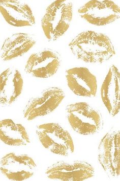 gold lipstick prints on white background