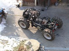 an atv is being worked on in the snow