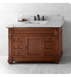 a bathroom vanity with marble top and two sinks