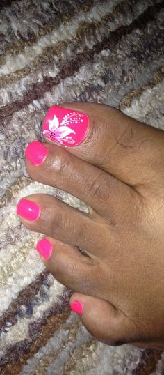 Pink toes with a white flower  Miracle Nails league city tx