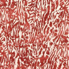 an abstract red and white pattern on fabric