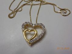 "Vintage double heart pendant necklace. 18\" gold plated sterling (925) chain made in Italy with a lobster claw fastener. Heart pendant is 1\" x 1\". Silver tone heart is loaded with tiny clear rhinestones, all of which are present and intact. A tiny gold tone heart is on the inside of the larger heart. The heart pendant is gold plated sterling (925) made in China. This is in excellent condition. Estate itemno info available." Gold Double Heart Necklace With Diamond Accents, Gold Heart Necklace With Diamond Accents For Anniversary, Funky Necklace, Pretty Accessories, Chanel Perfume, Jewelry Accessories Ideas, Accessories Ideas, Jewelry Lookbook, Double Heart