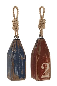 two wooden tags with rope hanging from the ends, one is red and one is blue