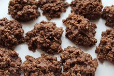 chocolate cookies are arranged on a white plate