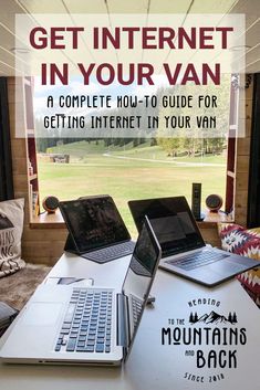 two laptops sitting on top of a white table in front of a window with the words get internet in your van