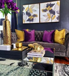 a living room with purple and gold decor