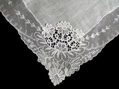 New old stock vintage wedding hanky with a fancy applique and lace border. Although never used, this hanky is slightly imperfect. Please view all photos, as you will see a couple of very small tears in the lace and a small tear in the linen center. Still very pretty, and perfect for a bride-to-be as her something old. All white, measuring 11 inches, and made of linen. Being sold AS IS, and priced accordingly. Vintage Lace With Lace Trim For Ceremony, Lace Handkerchiefs With Lace Trim For Wedding, Elegant Lace Handkerchiefs With Lace Trim, Lace Wedding Handkerchiefs With Lace Trim, Elegant Lace Wedding Handkerchief, Elegant Wedding Handkerchief With Lace Work, Elegant Lace Work Handkerchief For Wedding, Elegant Lace Work Wedding Handkerchief, Vintage Lace Trim Handkerchiefs For Wedding