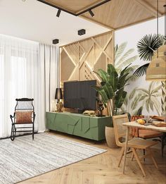 a living room filled with furniture and a flat screen tv sitting on top of a wooden table