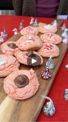 cookies and candies on a wooden cutting board