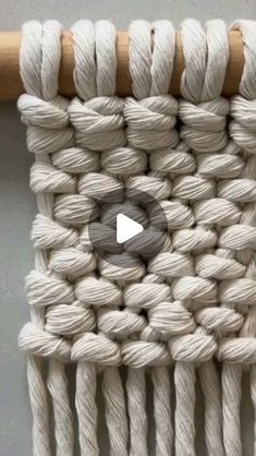 the video shows how to make a macrame wall hanging with yarn and cotton