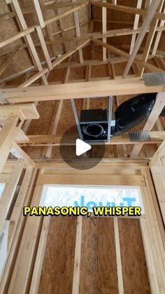 the inside of a house being built with wood framing and an air ventilator